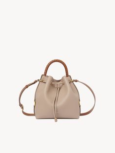 Chloé Marcie Bucket Bag | Chloé US Luxury Textured Leather Bucket Bag For Travel, Luxury Beige Textured Leather Bucket Bag, Leather Bucket Bag For Everyday Luxury, Textured Calf Leather Bucket Bag, Textured Leather Bucket Bag For Travel, Calf Leather Bucket Bag For Everyday, Pebbled Leather Bucket Bag, Calf Leather Bucket Bag For Travel, Leather Tote Bucket Bag For Everyday Luxury