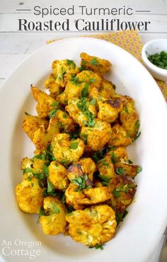 roasted cauliflower with herbs in a white bowl