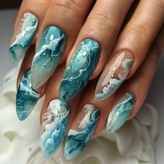 This summer, one of the trendiest nail designs is the ocean theme! Dive into the magical world of the sea and marine textures. Vibrant shades of blue, pearly accents, and wavy patterns will give your nails a unique style. Stay on trend with Mars Nails! #summernails Marine Nails Designs, Water Nail Designs, Water Themed Nails, Crazy Nail Designs Unique, Ocean Theme Nails, Ocean Nails Sea, Blue Ocean Nails