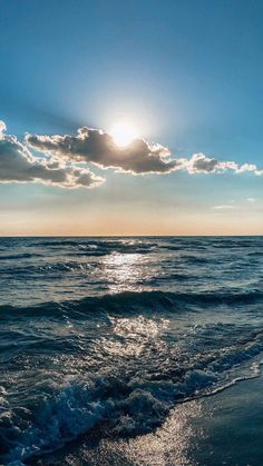 the sun shines brightly over the ocean as it reflects in the water's surface