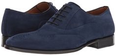 Modernize your handsome look with these classic Mezlan Men's oxfords shoes. Upper made of rich calfskin suede leather. Lace-up construction. Wingtip toe with medallion detail. Leather lining. Lightly cushioned footbed. Stacked heel. Leather outsole. Made in Spain. #oxfordshoes #menshoes mens oxfords shoes | mens oxfords shoes brown | mens oxfords shoes outfit | mens oxfords shoes casual | mens oxfords shoes with jeans | Wing Tip Shoes, Your Handsome, Oxfords Shoes