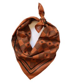 a scarf with an orange and black pattern