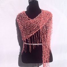 "This shimmery shawl might not keep you warm, but it is definitely a hot accessory!  Very lightweight, it is appropriate for any season. It is knitted completely by hand in an unusual \"yarn\" that looks like beads from a distance. It can be worn as either a shawl, a scarf, a belt, or a sarong. Be prepared for comments and compliments--this scarf is an eye-catcher  And with FREE fast shipping, you will have this scarf in just a few days. *Completed and ready to ship FREE. *Made entirely by hand One Size Knit Shawl Scarves, One Size Knit Shawl Scarf, One Size Knitted Yarn Shawl, One Size Knitted Shawl Made Of Yarn, Knitted Yarn Shawl, One Size Knitted Shawl In Acrylic Yarn, Hand Knitted Acrylic Shawl One Size, One Size Open Knit Shawl, Bohemian Knit Scarves One Size