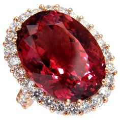 Tourmaline Prime 21.13ct. Natural Red Tourmaline ring. Report: 1172479835 Oval cut: 20.12 X 15.05 X 10.48mm Transparent, Vibrant Purplish Red & Clean Clarity. GIA: "Rubellite" 3.00ct. Side natural round diamonds: G-color, Vs-2 clarity. 18kt. rose gold 14.5 grams. Deck of ring: 25 x 19.5mm Depth: 12.3mm current ring size: 6.5 May be resized. $36,000 Appraisal Certificate to accompany & GIA Red Diamond Ring, Tourmaline Rings, Tsavorite Ring, Red Diamonds, Red Tourmaline, Ruby Rings, Special Ring, Tourmaline Jewelry, Red Jewelry