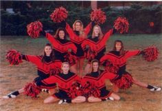 a group of cheerleaders posing for a photo