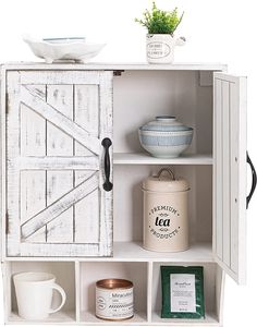 an open cabinet with tea and coffee mugs on the shelf next to each other