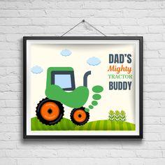 a green tractor with the words dad's mighty tractor buddy on it hanging from a brick wall