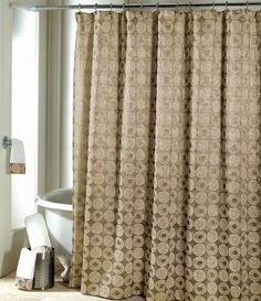 a bathroom with a shower curtain and toilet