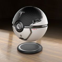 a white and black helmet sitting on top of a wooden floor