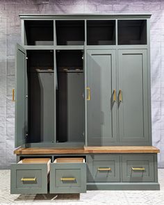 a large gray closet with drawers and shelves