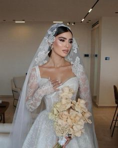 a woman in a wedding dress holding a bouquet