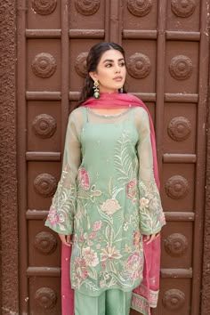 Mint Green Pakistani Dress in Kameez Trouser Style is an elegant masterpiece to have a breathtaking appearance on the big day. Hand-crafted work of Resham and floral designs make this stunning Pakistani Party Dress your foremost priority to have a charismatic look. Kameez: The beautiful kameez in an alluring mint green shade comes in pure organza fabric. The stunning mint kameez is emblazoned with graceful embroidery, dabka, floral designs, and resham work. Hand-crafted embellishments of sequins Mint Green Suits Women, Mint Green Color Combinations, Green Pakistani Dress, Green Pakistani Suit, Kameez Ideas, White Pakistani Suit, Green Suit Women, Pakistani Suits Party Wear, Green Contrast Color