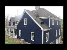 a blue house with white trim and windows