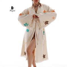 Add a vibrant touch to your beach look with this Boho colorful leaf beach kimono robe made of organic cotton. This exquisite robe features a unique leaf print in cheerful hues, perfect for adding a splash of color to your outfit. Made from soft and breathable organic cotton, this kimono robe is not only stylish but also comfortable to wear. Perfect for a day by the beach or pool, this versatile robe is sure to become a staple in your summer wardrobe. Stand out in style with this eye-catching and Wardrobe Stand, Beach Kimono, Beachy Boho, Print Kimonos, By The Beach, Beach Look, Colorful Leaves, Colorful Boho, Boho Beach