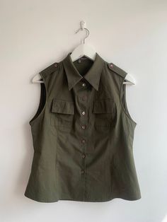 Vintage Cotton Sleeveless Blouse Size M, Retro Summer Button Up Tank Top, Woman Military Green Top with Collar, Vintage Khaki Vest Shirt by BlastFromThePastBags on Etsy Fitted Collared Military Top, Cotton Sleeveless Blouse, Military Style Cotton Tops With Snap Buttons, Button Up Tank Top, Olive Cotton Military Style Tops, Green Military Button-up Top, Khaki Military Tops With Patch Pockets, Vest Fits, Khaki Vest