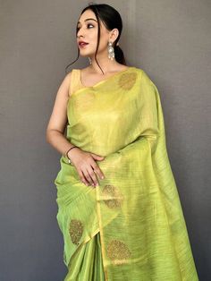 Nothing will be comparable when your beauty will be combined with this stunning tissue silk material light green saree beautified with jacquard zari weaving with motifs all over the borde work and having rich pallu. This awesome woven silk light green saree comes with a golden color plain blouse in silk fabric. This stunning traditional woven silk saree is 5.50 meters long and comes with fully unstitched 1.00 meters blouse material. Update your clothing style as per trend with this beautiful sil Festive Slub Silk Dupatta, Green Slub Silk Blouse For Navratri, Pista Green Cotton Silk Pre-draped Saree With Cutdana, Designer Pista Green Pre-draped Cotton Silk Saree, Pre-draped Cotton Silk Saree With Dori Work For Festivals, Tissue Silk Dupatta For Navratri, Festival Pre-draped Saree With Dori Work In Cotton Silk, Diwali Designer Slub Silk Traditional Wear, Festive Cotton Silk Pre-draped Saree With Dori Work