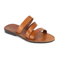 Classic Slide Sandals For Vacation, Classic Slide Sandals For The Beach, Classic Leather Toe Loop Flip Flops, Classic Leather Slides For Vacation, Classic Single Toe Strap Slides For Beach, Classic Beach Slides With Single Toe Strap, Classic Leather Footbed Sandals For Vacation, Leather Toe Loop Slides For Beach, Classic Beach Sandals With Single Toe Strap