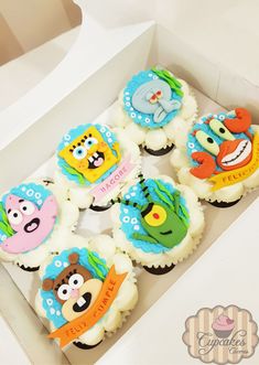 the cupcakes are decorated with cartoon characters