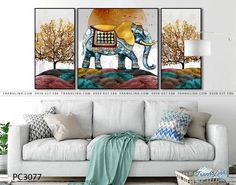 an elephant is standing in the middle of a living room with two paintings on the wall