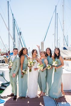 a group of people that are standing on a dock