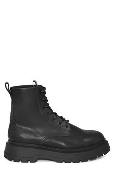 A superchunky lug sole extends the utilitarian aesthetic of this combat boot crafted of leather with dual pull-loops for easy-on wear. Leather upper and lining/synthetic sole Imported Urban Combat Boots With Lug Sole For Streetwear, Edgy Leather Combat Boots For Work, Leather Footbed Combat Boots For Fall Streetwear, Fall Combat Boots With Vibram Sole For Streetwear, Casual Leather Combat Boots With Lug Sole, Rugged Ankle Combat Boots For Work, Urban Leather Combat Boots For Streetwear, Rugged Moto Boots With Lug Sole For Streetwear, Edgy Outdoor Combat Boots With Lug Sole