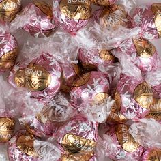 pink and gold candy wrapped in cellophane