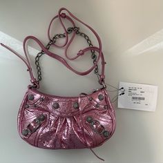 Brand New Bag In Excellent Condition. This Bag Comes In A Metallic Pink Color With Strass Studs Accents. Bag Comes With Dust Bag. Also A Strap So It Can Be Worn As A Shoulder Bag Designer Pouch Shoulder Bag, Designer Crossbody Evening Bag For Shopping, Designer Crossbody Clutch For Shopping, Silver-tone Crossbody Shoulder Bag, Clutch Shoulder Bag With Silver-tone Hardware, Designer Crossbody Bag With Chain Strap, Designer Evening Bag With Adjustable Strap, Fashion Accessory Shoulder Bag With Silver-tone Hardware, Designer Chain Strap Satchel Shoulder Bag