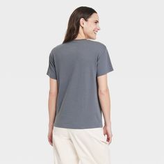 Upgrade your casual wardrobe with the lightweight Women's NYC Short Sleeve Graphic T-Shirt in Gray. Blended with polyester and cotton to provide a soft, breathable feel, allowing you to stay flexible and relaxed all day. The regular fit is meant for a classic look with a pullover design for effortless styling. The lightweight fabric ensures a comfy feel and is easy to layer in warmer weather. Easy to care for, simply toss it in a washing machine and tumble dry to make laundry day a breeze. Comfortable Cotton V-neck Tops, Comfortable Gray Cotton Top, Casual Solid Color Shirt For Loungewear, Comfortable Everyday Gray Tops, Casual Gray Loungewear Top, Casual Solid Color T-shirt For Loungewear, Casual Solid T-shirt For Loungewear, Casual Shirt With Comfortable Fit And Crew Neck, Casual Soft-washed Tops With Comfortable Fit