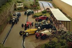 an assortment of toy cars and trucks on display