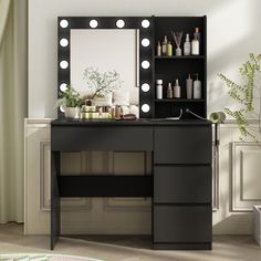 a black vanity with lights on it next to a mirror