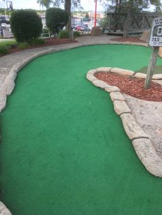 a miniature golf course in the middle of a park