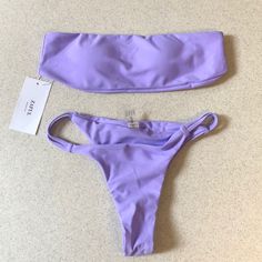 Lavender Padded Wire Free Nylon And Spandex Purple Stretch Strapless Swimwear, Purple Strapless Stretch Swimwear, Lavender Stretch Swimwear For Beach Season, Strapless Purple Swimwear For Summer, Lavender Stretch Swimwear For Summer, Purple Bandeau Swimwear For Swimming, Purple Bandeau Swimwear, Summer Lavender Stretch Swimwear, Purple Fitted Strapless Swimwear