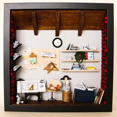 a miniature model of a room with shelves and desks