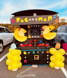 an arcade machine decorated with balloons and decorations