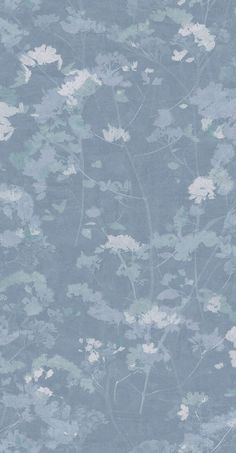 a blue wallpaper with white flowers on it