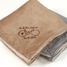 two personalized wedding handkerchiefs on top of each other