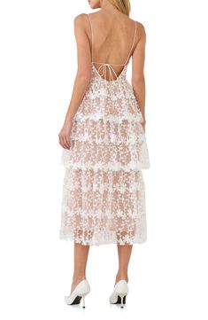 Make an enchanting impression at any occasion in this romantic lace midi dress wrapped in embroidered blooms. Sweetheart neck Adjustable tie straps Lined 100% polyester Hand wash, dry flat Imported Feminine Delicate Lace Midi Dress For Wedding, Delicate Strap Lace Party Dress, Lace Party Dress With Delicate Straps, Delicate Lace Party Dresses With Straps, Delicate Lace Dresses With Straps For Wedding, Delicate Straps Lace Wedding Dress, Delicate Strap Lace Wedding Dresses, Lace Wedding Dress With Delicate Straps, Wedding Dresses With Delicate Lace Straps