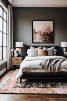 a large bed sitting in a bedroom next to two lamps