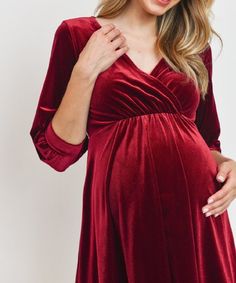 We can't get enough of this soft and beautifully flowing stretch velvet number for the holiday season into Vday! Looks flattering on all body types. Features a bonus opening for postpartum nursing-access. Color: Burgundy Above-the-knee Stretch Fabric: 92% Polyester 8% Spandex Maternity, Non-Maternity & Nursing-Friendly Size Chart Questions? Use the chat icon to connect with a stylist! Christmas Party Dress Pregnant, Holiday Party Dresses Pregnant, Maternity Dress Velvet, Maternity Dresses Winter, Red Velvet Maternity Dress, Velvet Maternity Dress, Cranberry Maternity Dress, Red Maternity Dress, Postpartum Dresses