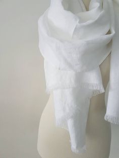 Scarf is made from pre-washed 100 % Linen fabric and is perfect for spring, summer, autumn and light winter days. The scarf will become softer with every wash. There are so many ways of using this linen scarf. It's also a great gift for any occasion. Size: ~35x190 cm / 14x71 inches ~45x190 cm / 18x71 inches ~70x198 cm / 28x78 inches Scarf is finished with fringes , but also can be made without fringes ( hemped ends ) , just note when ordering. If you need different size , please contact me for d White Shawl, Linen Scarf, Wrap Gift, White Woman, Linen Scarves, Gift For Mother, White Linen, Winter Scarf, Womens Scarves