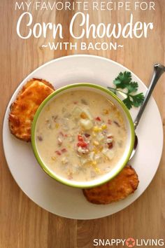 a bowl of soup and two pieces of bread on a plate