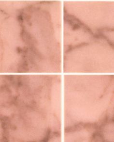 four square marble tiles that are white and brown