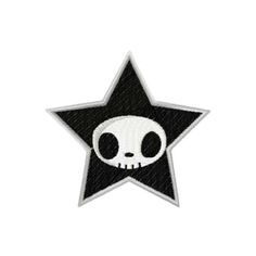 a black and white star with a skull on it