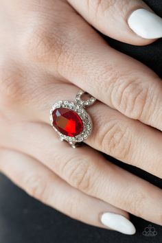 An oval red gem is pressed into the center of a dainty silver frame radiating with glassy white rhinestones for a regal flair. Features a dainty stretchy band for a flexible fit.

Sold as one individual ring. Paparazzi Accessories Jewelry, Red Ring, Red Rings, Fun Jewelry, Rhinestone Ring, Paparazzi Accessories, Oval Rings, Blue Gems, White Rhinestone