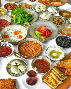 a table topped with lots of different types of food