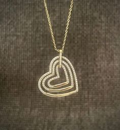 This triple heart necklace features three interlocking hearts lined with simulated diamonds, all beautifully set in sterling silver dipped in 14k gold. This elegant piece adds a touch of romance and sophistication to any outfit. Mom Daughter Necklace, Sophia Necklace, Triple Heart, Three Hearts, Interlocking Hearts, Necklace Love, Daughter Necklace, Mom Daughter, Love Necklace