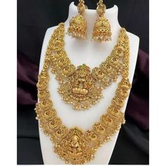 Description: Enhance your elegance with this stunning Traditional Indian Kundan Necklace Set featuring matching earrings, meticulously crafted to perfection. This exquisite jewelry set is the epitome of luxury, blending traditional design with contemporary flair, making it a must-have for every jewelry collection. Product Features: Material: High-quality Kundan stones, gold-plated alloy, and pearl detailing. Design: Intricately designed with a beautiful combination of green and pink beads that add a pop of color, perfect for any occasion. Earrings: Matching earrings with a comfortable fit, complementing the necklace perfectly. Necklace Length: Adjustable with a drawstring closure to suit your neckline and preference. Occasion: Ideal for weddings, bridal wear, engagements, festive occasions Dual-tone Bollywood Jewelry For Wedding, Dual-tone Bollywood Wedding Jewelry, Dual-tone Chandbali Jewelry Sets For Weddings, Elegant Dual-tone Chandbali Jewelry Sets, Elegant Dual-tone Chandbali Bridal Necklace, Elegant Hand Set Temple Necklace For Puja, Festive Temple Jewelry Sets With Elegant Design, Bollywood Style Elegant Jewelry Sets For Festivals, Gold Dual-tone Jewelry For Wedding