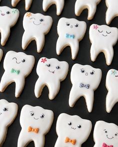 decorated cookies are arranged in the shape of toothpaste with bow ties on them