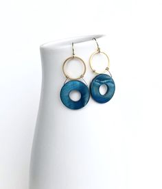 Blue mother of pearl earrings. #earrings #jewelry Modern Nickel-free Round Disc Earrings, Hypoallergenic Metal Circle Earrings, Modern Jewelry With Matching Open Circle Earrings, Modern Open Circle Jewelry With Matching Earrings, Blue Metal Jewelry, Modern Round Brass Earrings, Hypoallergenic Brass Circle Jewelry, Elegant Metal Round Disc Earrings, Modern Circular Pierced Jewelry