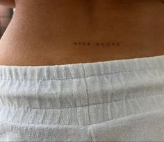 the back of a woman's stomach with an inscription on it that reads vive amora